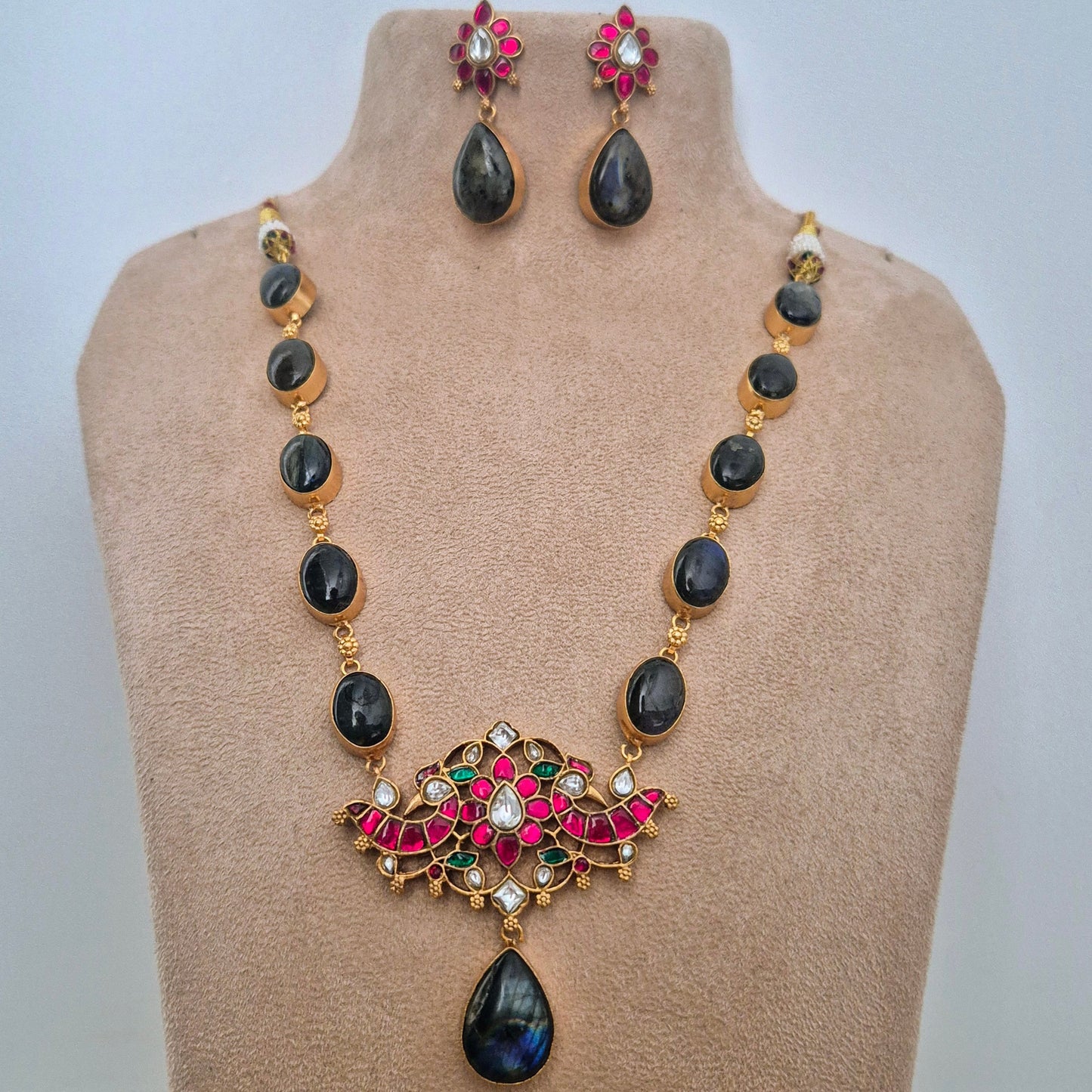 Labradorite gemstone coupled with Fuschia pink Jadau Kundan Set
