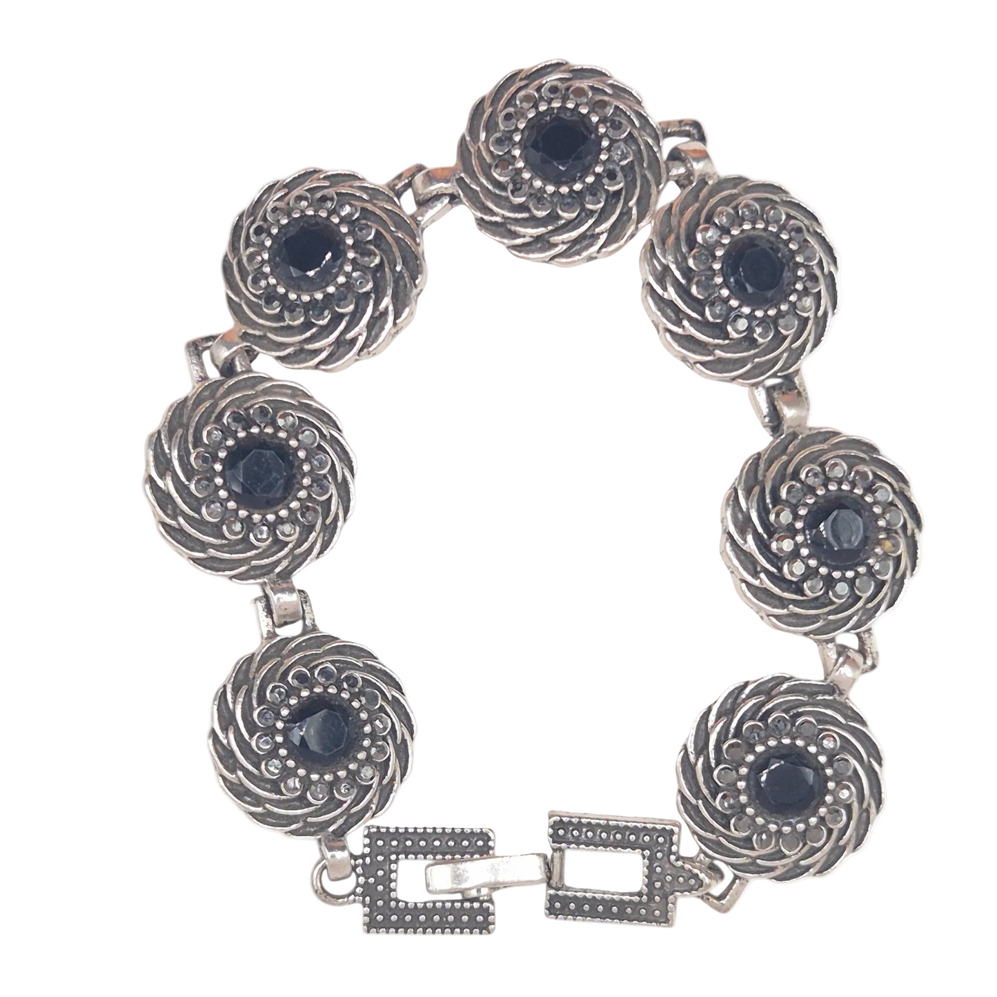 Black flower on spiral in brass