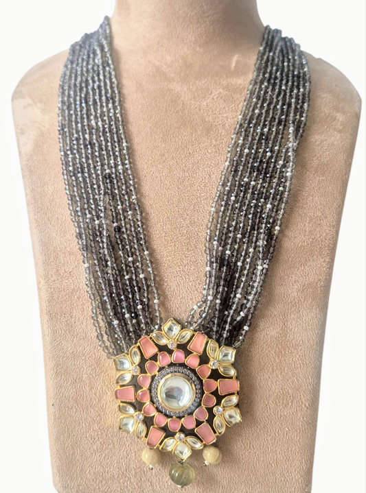 Grey Crystals with Peach Kundan pendant giving a chic look