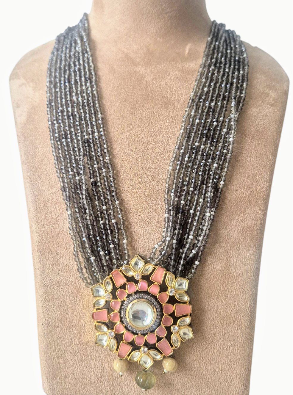 Grey Crystals with Peach Kundan pendant giving a chic look