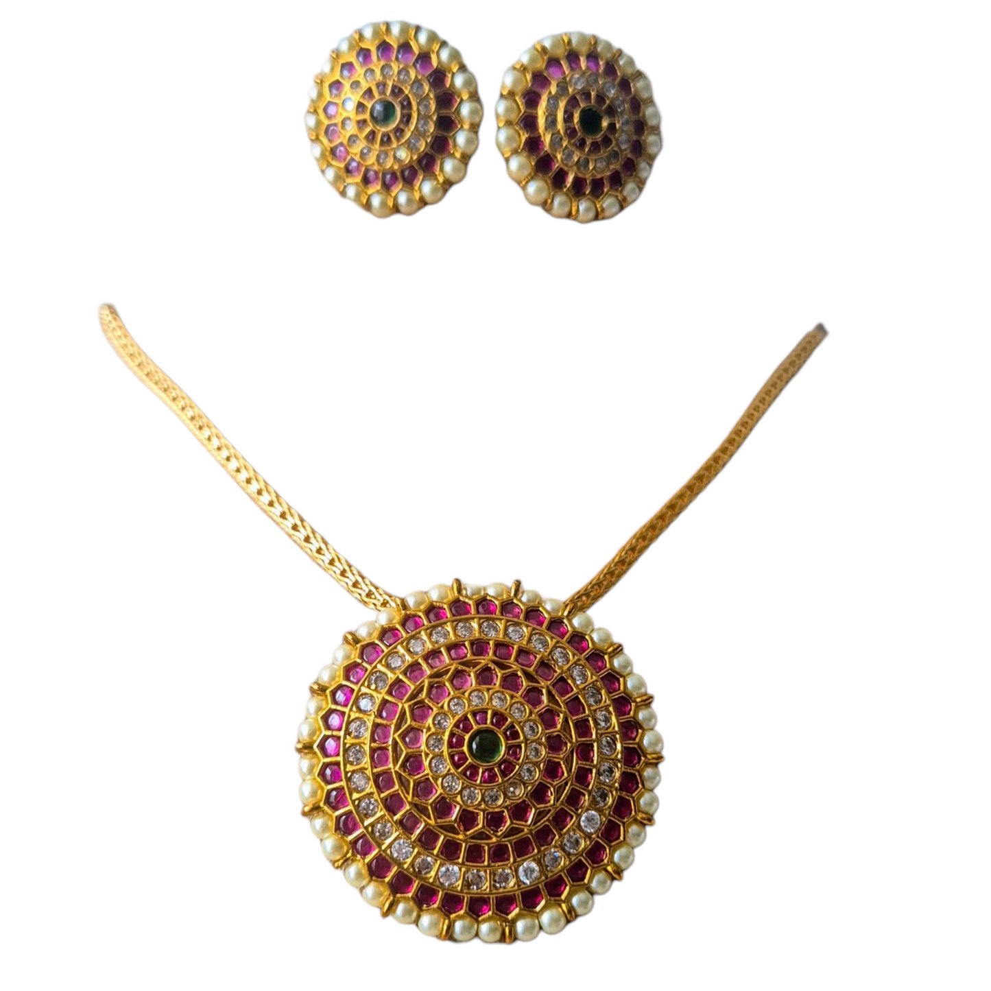 Fushcia Pink jadau, white kundan and golden pearls set makes this evergreen design