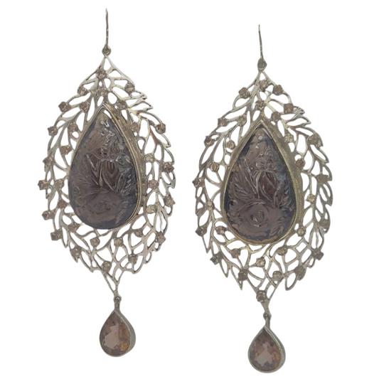 Natural Smoky Topaz carved and set amongst scattered filigree work , design inspired from the season of Autumn, set in 925 Silver