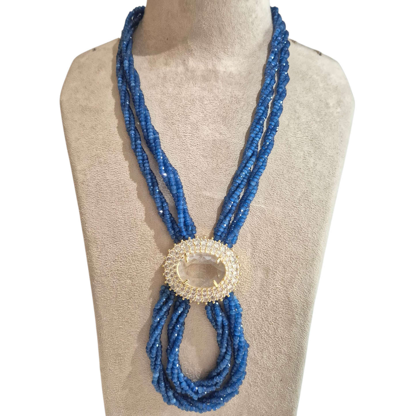 Blue czech beads entwined to make this necklace with a crsytal pendant