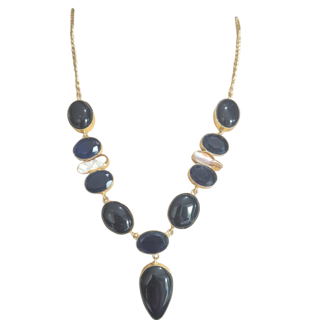 Black and dark blue quartz in brass