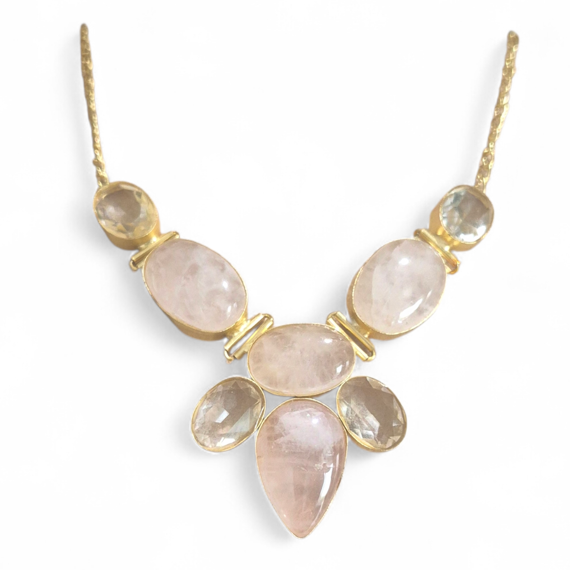 Rose quartz and white quartz in brass