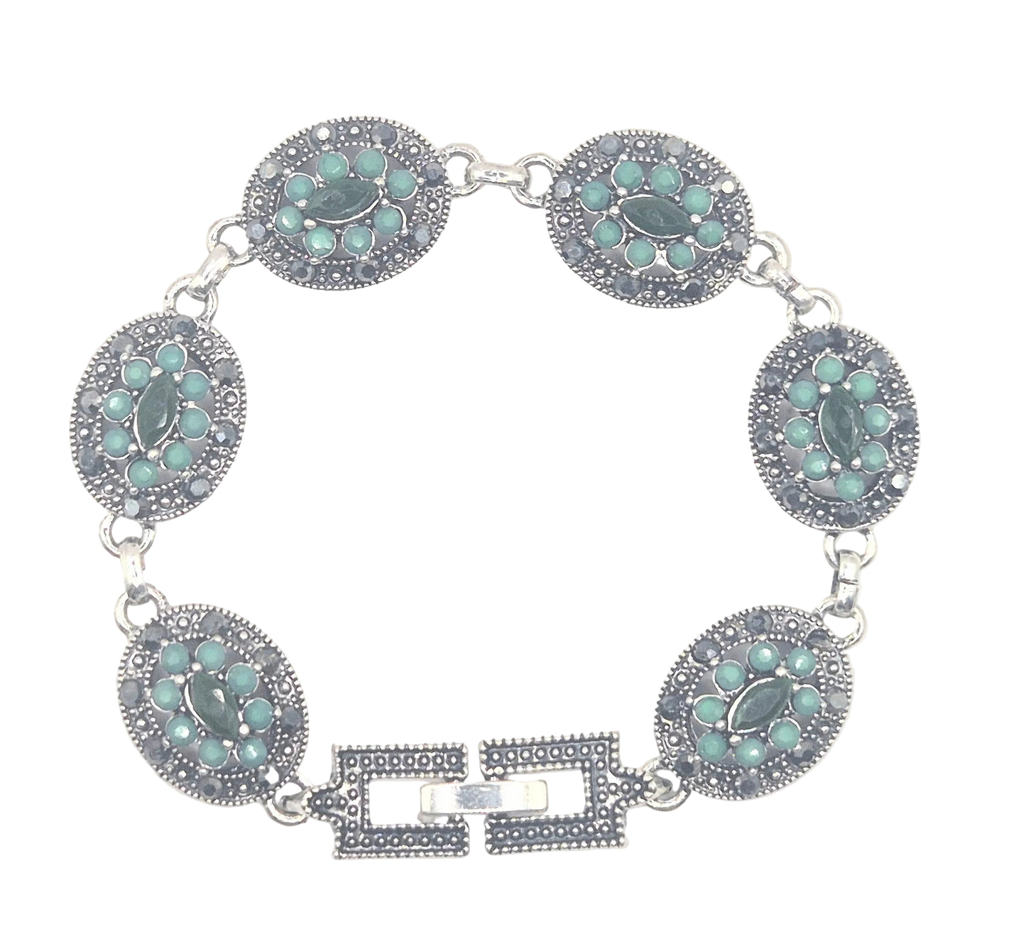 Green quartz in an antique setting in brass