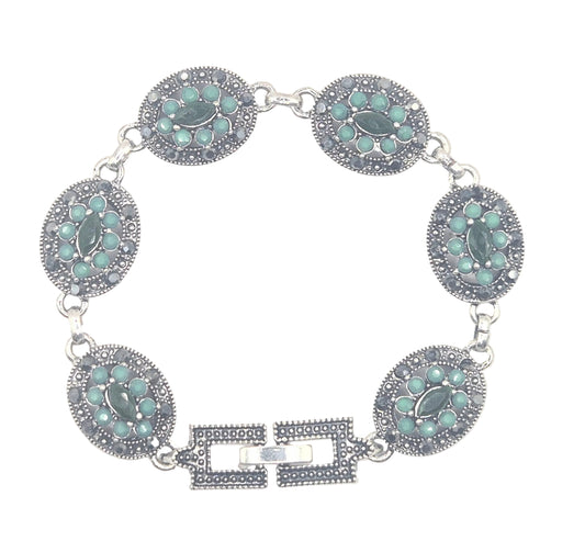 Green quartz in an antique setting in brass