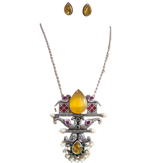 Yellow, green and red quartz with a peacock motif in brass with pearls