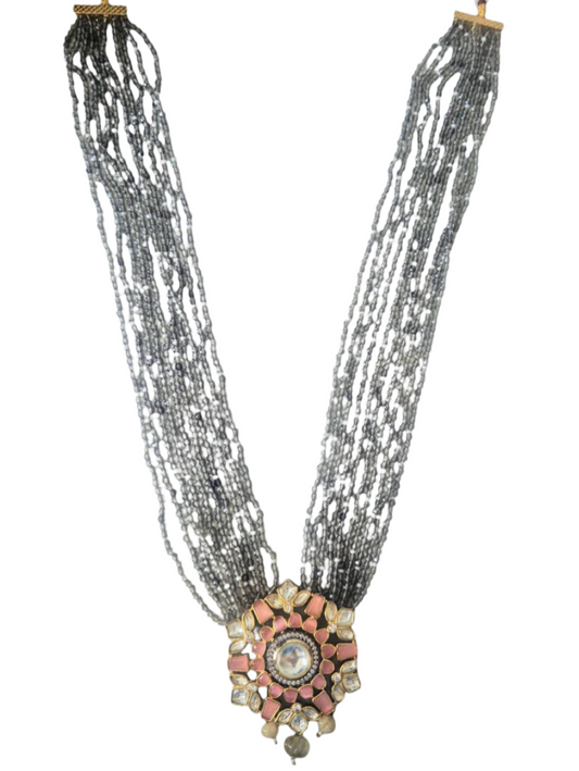 Grey Crystals with Peach Kundan pendant giving a chic look