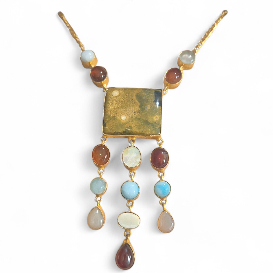 Orange, blue and white quartz in brass