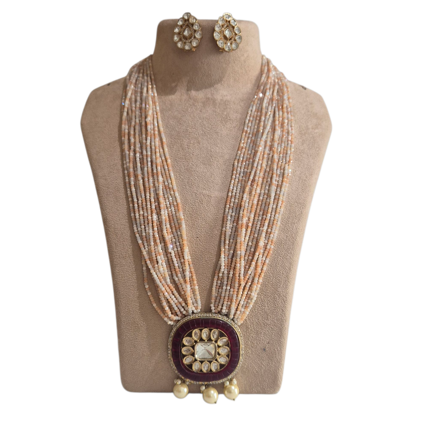 Peach czech beads with a red pendant made with kundan in brass