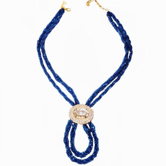 Blue czech beads entwined to make this necklace with a crsytal pendant
