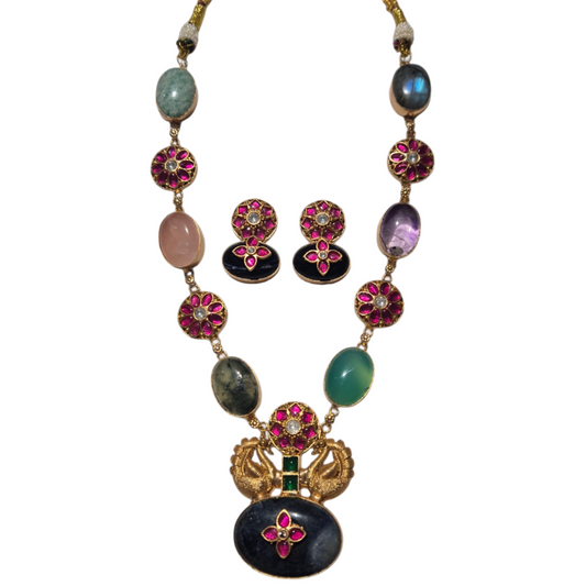 Multi-gemstone necklace set in an art deco design in brass