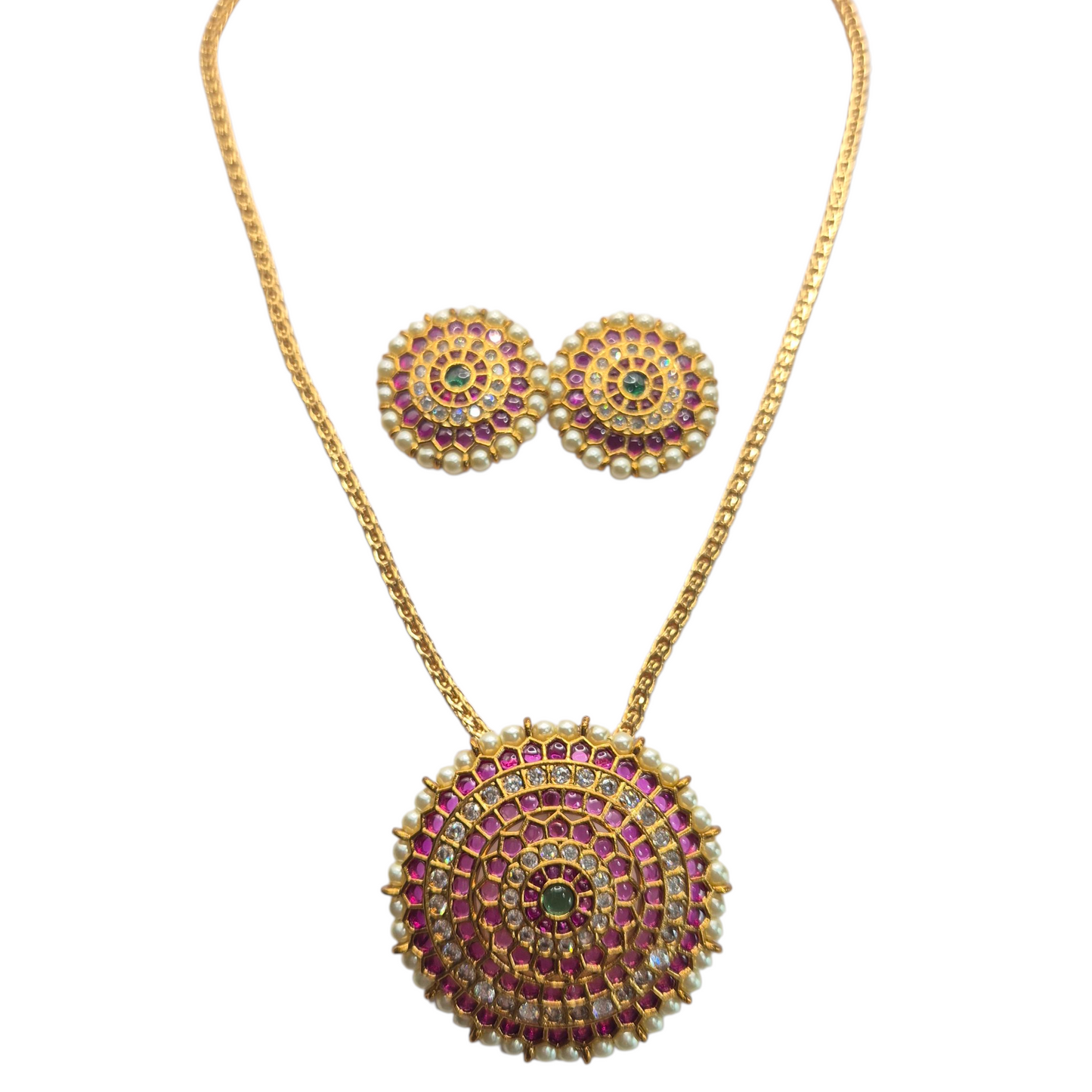 Jadau and Kundan make this timeless set in Brass
